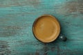 Espresso coffee cup on grunge blue table surface