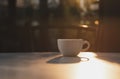 Espresso coffee cup on table cafe and sunlight in the morning Royalty Free Stock Photo