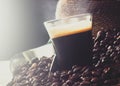 Espresso coffee in glass cup with coffee beans Royalty Free Stock Photo