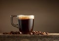 Espresso coffee glass cup on a brown background Royalty Free Stock Photo