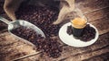 Espresso coffee in glass cup with coffee beans. Royalty Free Stock Photo
