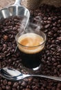 Espresso coffee in glass cup with coffee beans. Royalty Free Stock Photo