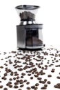 Espresso coffee grinder defocued in the background of coffee beans Royalty Free Stock Photo