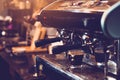Espresso coffee maker machine working in pub and restaurant bar background. Business food and drinks concept Royalty Free Stock Photo