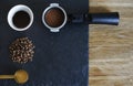 Espresso coffee set up on stoun wooden background from above. beans, grounded coffee, filter holder, portafilter Royalty Free Stock Photo