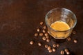 An espresso coffee shot on rustic table background. Royalty Free Stock Photo