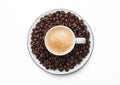 Espresso coffee in small cup and fresh raw beans on saucer on white background Royalty Free Stock Photo