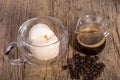 Espresso coffee and Vanilla ice cream in double walled glass italian dessert, with coffee beans on the rustic wooden tab Royalty Free Stock Photo