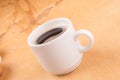 Espresso coffee in a white china cup over wood Royalty Free Stock Photo