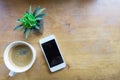 Espresso coffee in white cup with smartphone with copy space Royalty Free Stock Photo