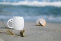 Espresso coffee in white cup with ocean waves Royalty Free Stock Photo