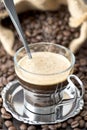 Espresso coffee with yuta background and coffee beans Royalty Free Stock Photo