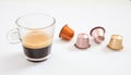 Espresso cup and coffee pods on white background, Closeup view with details Royalty Free Stock Photo