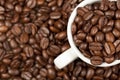 Espresso cup full with roasted coffee beans Royalty Free Stock Photo