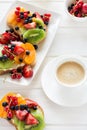 Espresso and fruit dessert sandwiches with ricotta cheese, kiwi, apricot, strawberry, blueberry and red currant Royalty Free Stock Photo