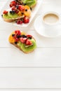Espresso and fruit dessert sandwiches with ricotta cheese, kiwi, apricot, strawberry, blueberry and red currant Royalty Free Stock Photo