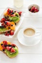 Espresso and fruit dessert sandwiches with ricotta cheese, kiwi, apricot, strawberry, blueberry and red currant Royalty Free Stock Photo