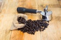 An espresso machine group head and coffee beans in sacks Royalty Free Stock Photo