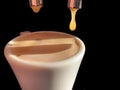 Espresso machine making coffee, golden espresso flowing closeup view Royalty Free Stock Photo