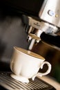 Espresso machine making coffee and pouring in a white cup Royalty Free Stock Photo