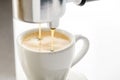 Espresso machine pouring strong fresh coffee into a ceramic cup Royalty Free Stock Photo