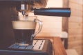 Espresso machine pouring strong looking fresh coffee in a glass Royalty Free Stock Photo