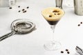 Espresso martini alcoholic cocktail with vodka, coffee liqueur, syrup and ice, white background, bar tools, copy space Royalty Free Stock Photo