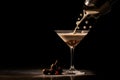 Espresso Martini Cocktail based on coffee, liqueur and vodka being poured on a dark background, copy space for text. Served in an Royalty Free Stock Photo