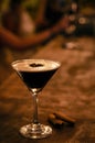 Espresso martini cocktail drink in cozy dark bar interior Royalty Free Stock Photo