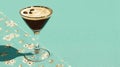 Espresso martini cocktail on mint backdrop with foam top Royalty Free Stock Photo