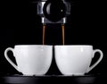 Espresso pouring from coffee machine. Royalty Free Stock Photo