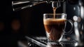 Espresso pouring from coffee machine into glass cup, closeup Royalty Free Stock Photo