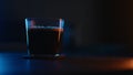 Espresso in tumbler glass with neon light