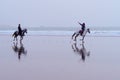 View of horses and riders on the beach, Essaouira