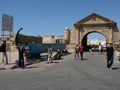 Group of people at the entrance arch of the fishing port of Essaouira, Morocco