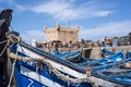 Fishing boats and ancient famous fort on background - Essaouira, Morocco