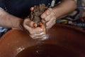 Making Argan Oil by Hand - squeezing pulp to release oil