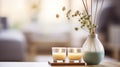 The Essence of Hygge with an Aroma Reed Diffuser, Candle, Eucalyptus, and Perfume Elegantly Arranged on a Home Table Royalty Free Stock Photo