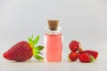 Essence of Wild strawberry on White background in beautiful glass jar Royalty Free Stock Photo