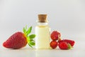 Essence of Wild strawberry on White background in beautiful glass jar Royalty Free Stock Photo