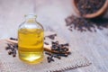 Essential aroma clove oil in a glass bottle. Royalty Free Stock Photo