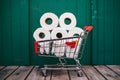 Essential convenience toilet paper rolls alongside a shopping cart