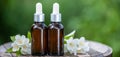 Essential Jasmine oil. Bioproduct, organic cosmetics. Perfumery, cosmetology, aromatherapy Royalty Free Stock Photo