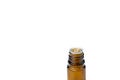 Essential medical oil in a brown glass bottle isolated on white background