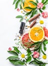 Essential oil for beauty skin. Flat lay beauty ingredients on a light background, top view. Beauty healthy lifestyle concept