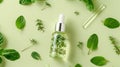 Essential oil. Botanical extract in dropper bottle with green leaves around. Green background. Concept of essence Royalty Free Stock Photo