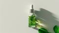 Essential oil. Botanical extract in dropper bottle with green leaves around. Light background. Concept of essence Royalty Free Stock Photo