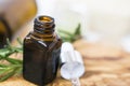 Essential oil bottle, aromatherapy herbal essential oil with dropper, spa still life closeup