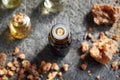 Essential oil bottle with myrrh resin Royalty Free Stock Photo
