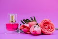 Essential oil in bottles extracted from rose leading to products that have an important ingredient is rose extract